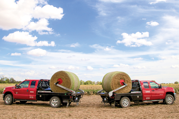 A parallel squeeze bale bed (L) next to a pivot squeeze bale bed (R)